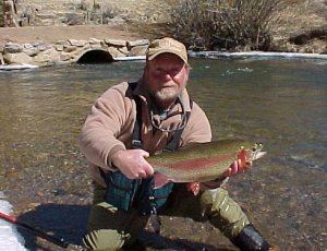Jay from Blue Quill with large rainbow in Colorado